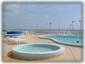 Upper sun deck with pool, kiddie pool and hot tub