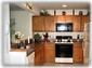 Wider Kitchen with Mounted Microwave, Garbage Disposal and Pantry