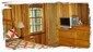 Solid wood furnishings and paneling in the master bedroom. TV w/ satellite.