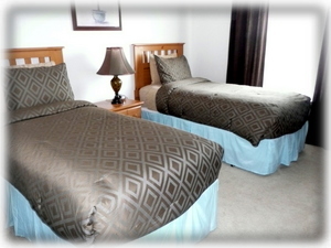 One of the spacious twin rooms with cable TV