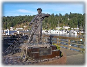 The nearby harbor and fisherman memorial