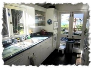 Sunny Kitchen with cafe windows & french door to views