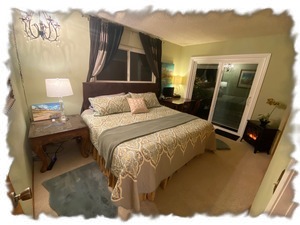 King Bedroom showing romantic fireplace in corner