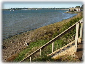 lower master bed deck leading down to harbor beach