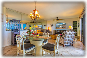 Living room and Dining area inside or out on the Lanai with a view of the ocean 