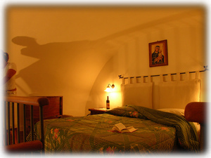 The bedroom on the open mezzanine, ground floor