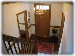 The stairway in the front hall leads to a room where you can store your luggage.