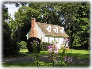 The Cottage in summer from across the back lawn.