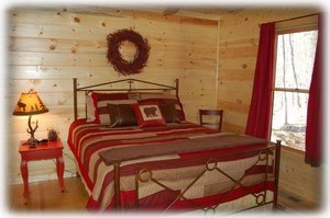 Main level bedroom with queen pillowtop bed