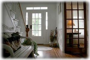 Inviting Entryway leading to front porch w/ rockers