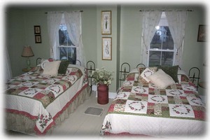 Sunfilled guest room with 2 full beds