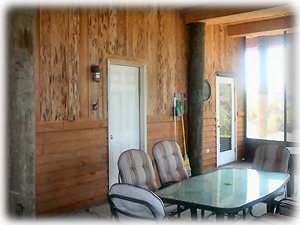 The screened porch has access to the lower level bedroom and the full bathroom