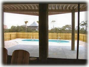 Here's a shot of the pool deck (without its furniture) from inside the porch