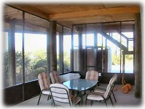 The large well furnished screened porch