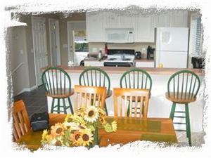 The dining room and kitchen area can sit 14 comfortably