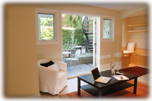 View from living area through French doors to patio