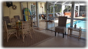 Screened Florida Room Overlooking Pool Area {Table Seats 4}