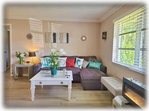 Living Room with Pull-out/Queen-Size Couch & Electric Fireplace 