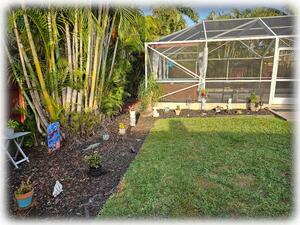 Tiki Garden Hot Tub & Pool View {Yard Surrounded by Solar Tiki Torches at Night}