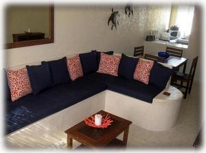 Living area with sofa sectional to kick back