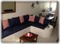 Living area with sofa sectional to kick back