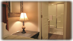 The bathroom has doors to the bedroom and hall.