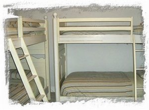 Third bedroom with two sets of bunks makes comfy island dreaming space for four!
