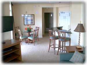 View from living room towards entry door & bar