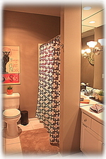 Bathroom with marble topped sink.