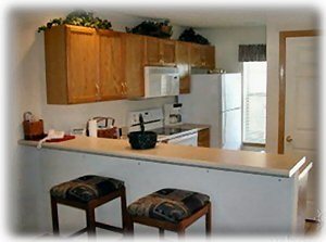 Fully equipped kitchen with snack bar. 