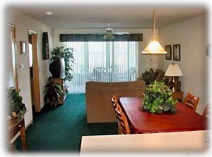 View of Dining Room/Living Room area with screened & glass enclosed patio.