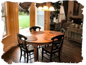 Informal Dining Area Just Off the Kitchen Looks Out to Backyard