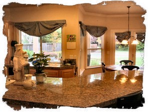 Kitchen Sink & Island Area Looks Out Into Backyard