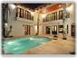 Tropical courtyard overlooking the pool with covered lanai