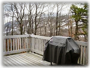 Winter view of main floor deck with view of Camelback Ski Mountain