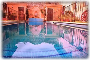 Our magnificent pool, with jacuzzi in the background. 