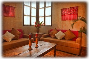 Our living room with Mayan textiles on the walls. 