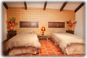 The upstairs bedroom with exposed brick. 