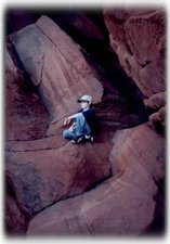 Exploring the sandstone cliffs, below us