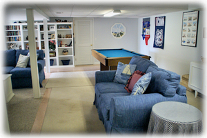 a view of the downstairs game room w/ pool table