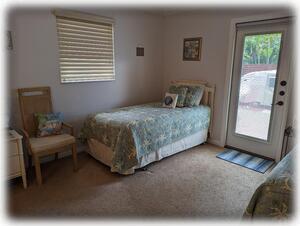 "Bahamas" Bedroom with Exterior Entrance to Tiki Garden & Access to Pool Deck