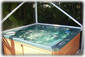 Deluxe Hot Tub with Waterfall & Colored LED Lights Overlooks Tiki Garden