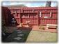 Gated Tiki Garden with Pathway to Screened Pool Deck