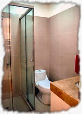 Guest bathroom with glass shower cubicle