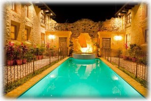 Our pool lit up at night.