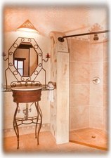 The bathroom picturing both shower and sink.