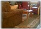The sofa pulls out, and the chairs are comfortable leather that swivel/recline 
