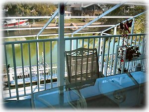 deck overlooking pool area and canal