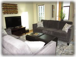 Living room with balcony door just beyond