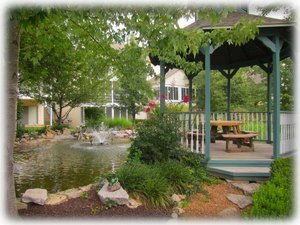 This delightful gazebo & pond are right behind your condos.